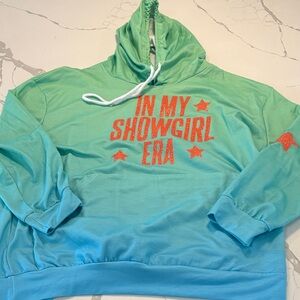 Green and Blue Hoodie with Red Text